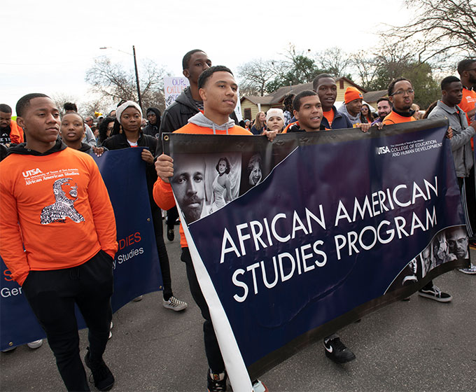 Students at the MLK March Holding a banner