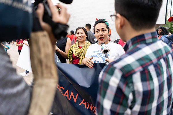 Person talking to a reporter at an event