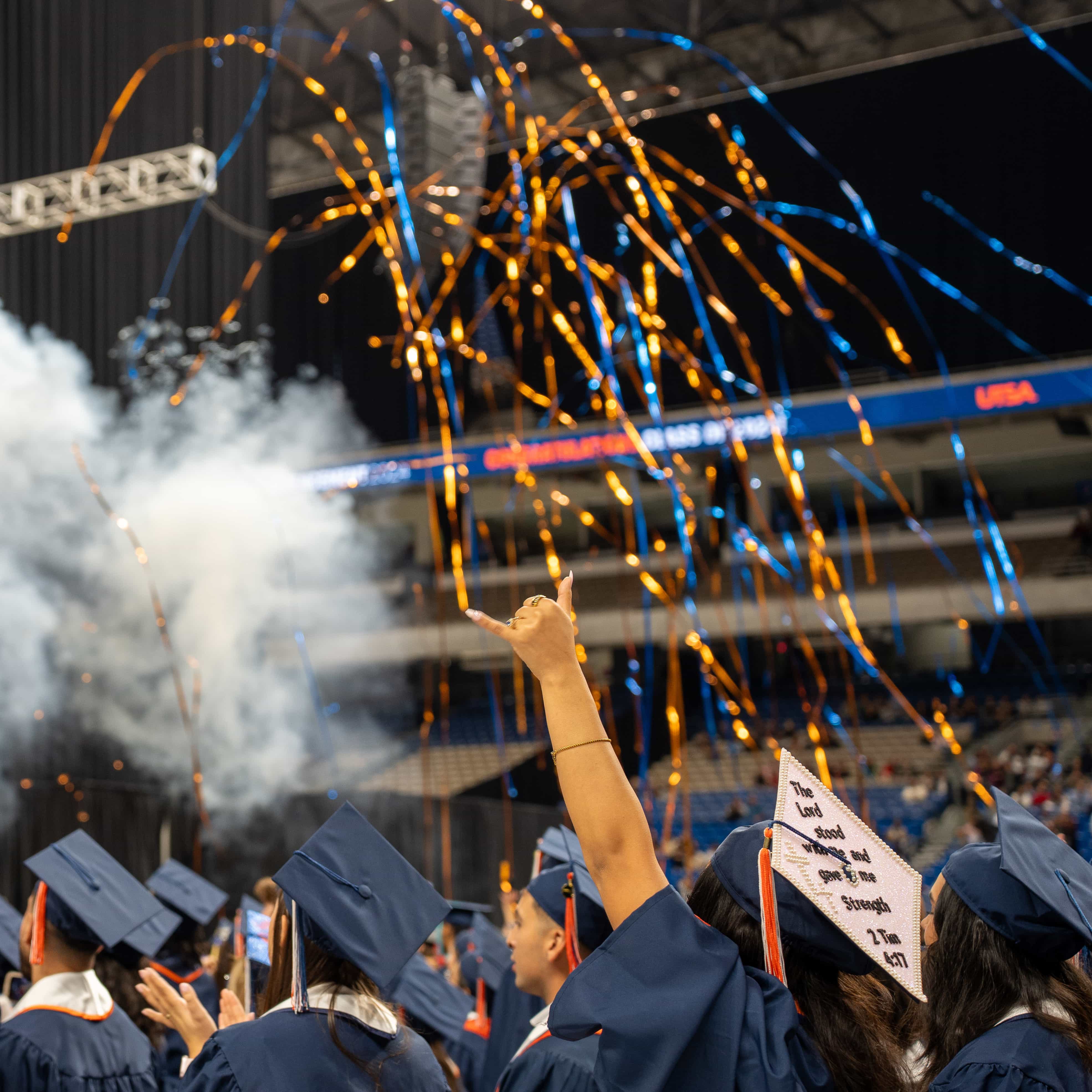 Fireworks and confetti fill the Alamodome as the commencement ceremony ends