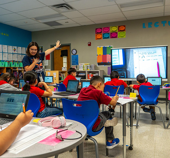 Bilingual teacher leads an English lesson