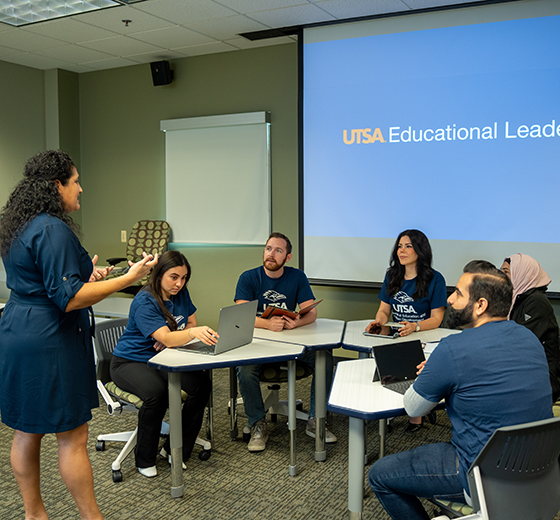 A professor is engaging with her students during a class