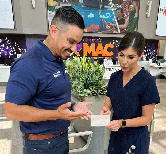 Two people review a information card on de-escalation strategies