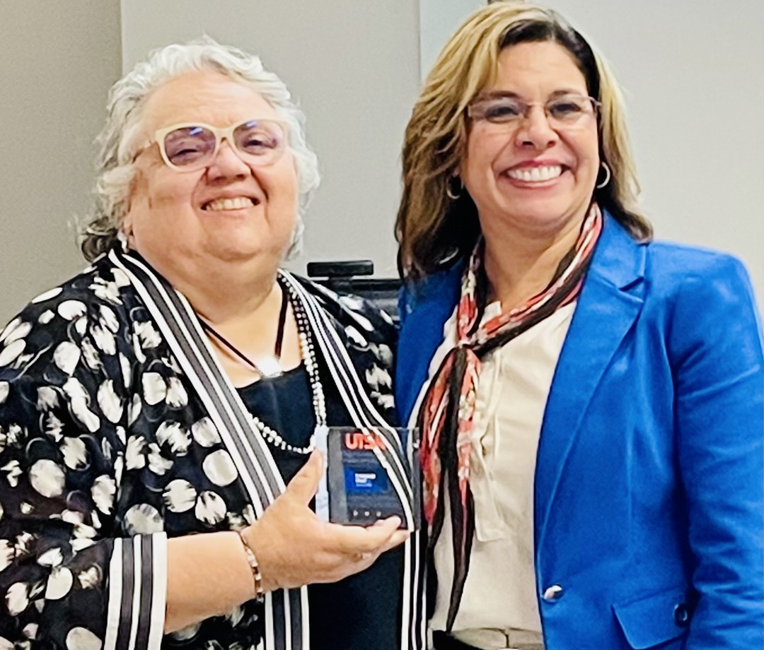 Belinda Bustos Flores and Juanita Santos at a Lab School Board Meeting. L to R: Dr. Belinda Bustos Flores, UTSA; Dr. Juanita Santos, Executive Director, UTSA Dual Language Community Lab Schools Partnership