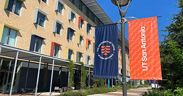 UT San Antonio banners in front of the North Paseo building