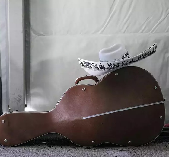 A sombrero sits on top of a guitarrón case during the Mariachi competition during Go Tejano Day at the Houston Livestock Show and Rodeo grounds in Houston on Sunday, March 16, 2025.
