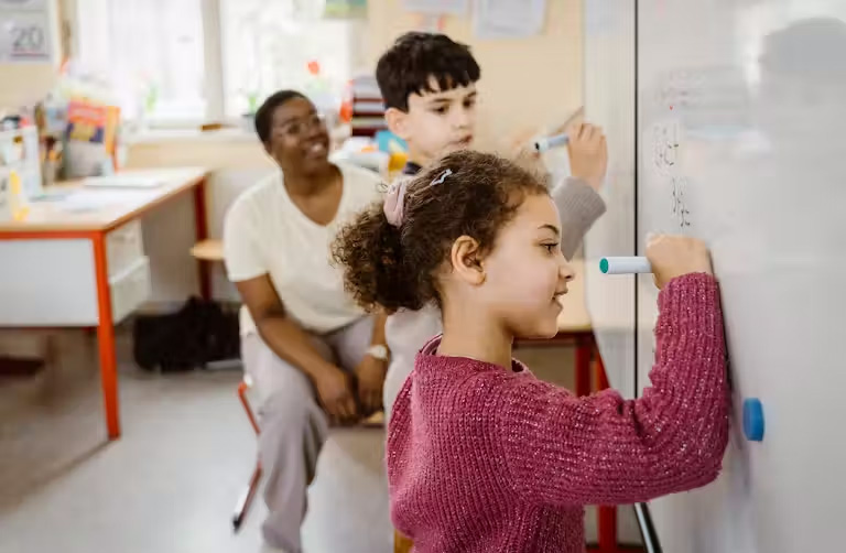 Teachers hold different views on why girls are good at math than they do for boys. Maskot via Getty Images