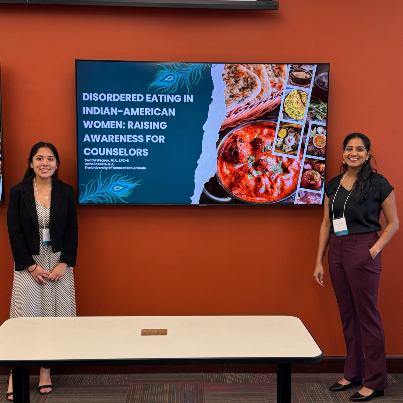 Left to right: Isabella Nieto and Swathi Weaver deliver a presentation on disordered eating among Indian-American women.
